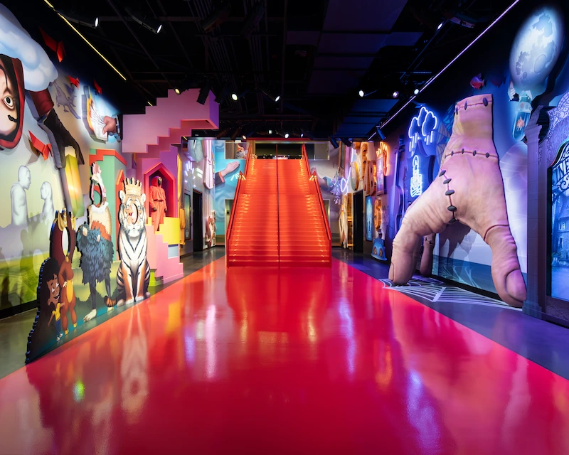 Red staircase to celebrate Netflix is surrounded by a Netflix themed mural.