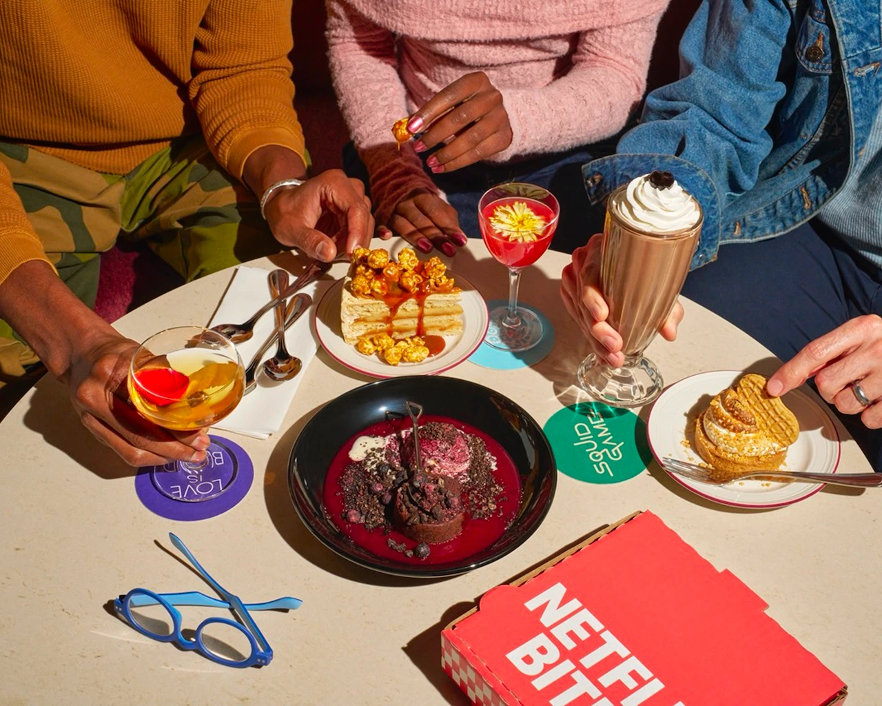 Tablespread of cocktails and dessert at Netflix Bites