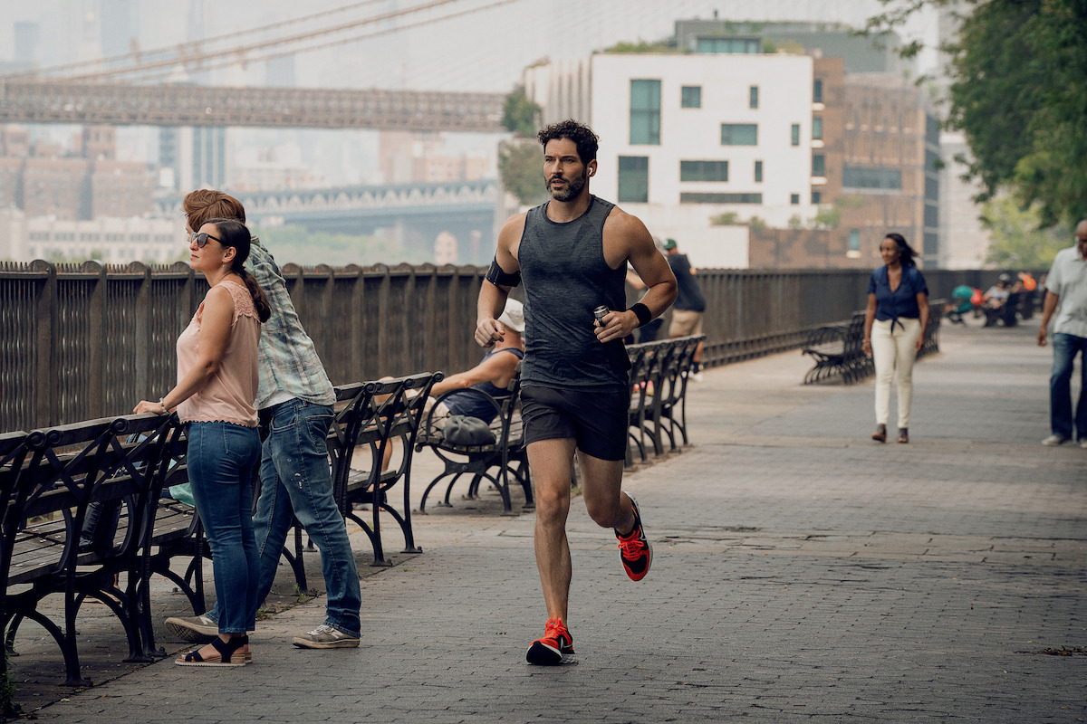 Tom Ellis as Nick running in ‘Players.’