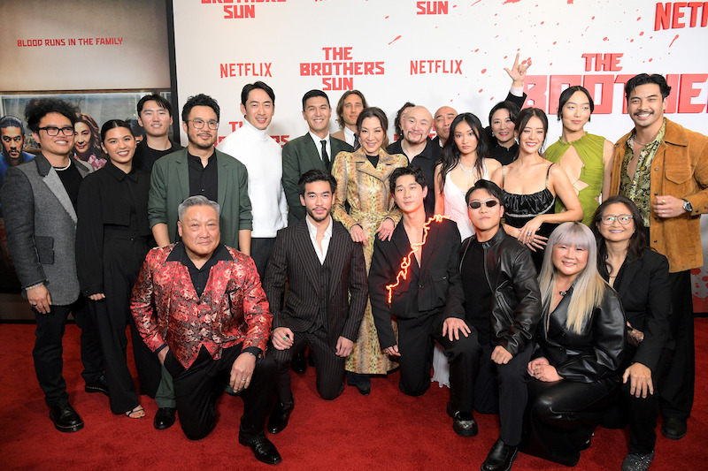 The Brothers Sun cast and crew pose for a group shot at Netflix's 'The Brothers Sun' Los Angeles Premiere at Netflix Tudum Theater 