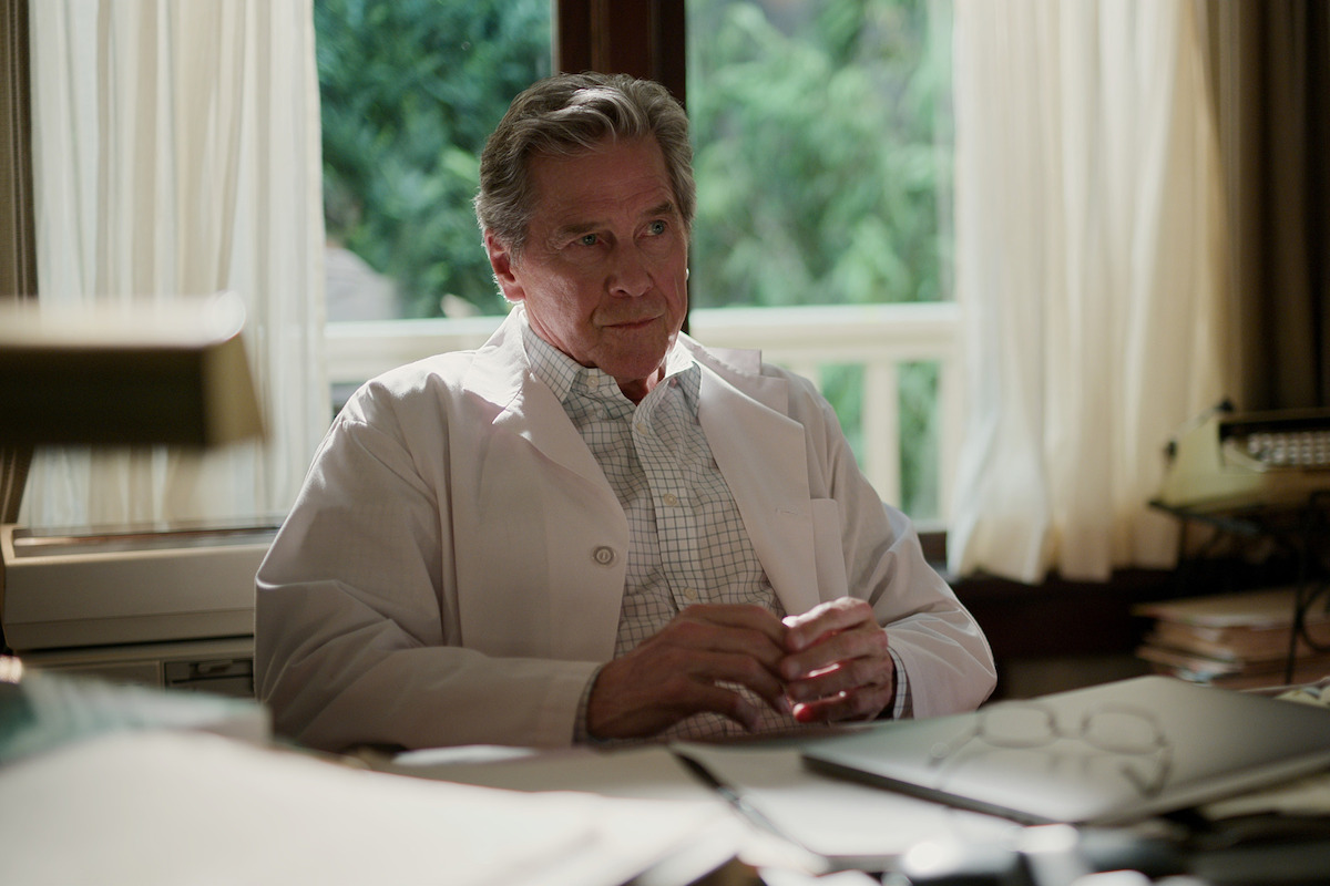 Tim Matheson as Vernon “Doc” Mullins sits at his desk in Season 5 of ‘Virgin River.’