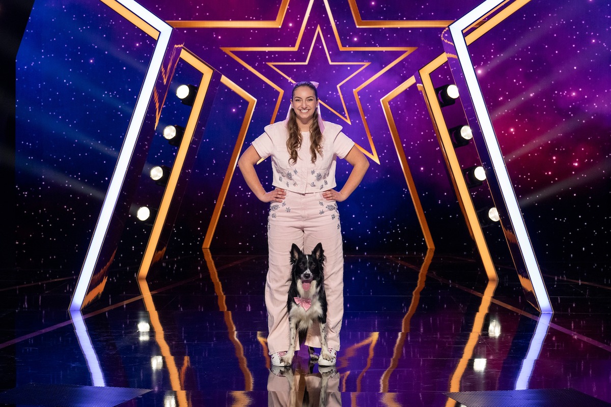 Macy and Tempo backed by colorful star-patterned lights and illuminated set design, suggesting a talent or variety show environment.