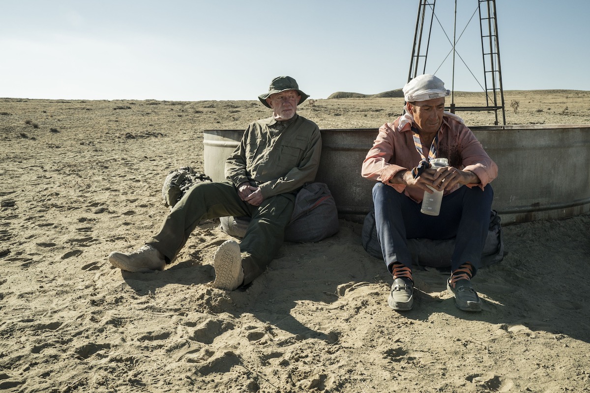 Saul and Mike resting next to a cow trough. 