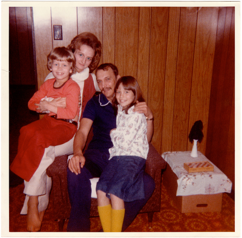 Pamela hanging out with her family at home.