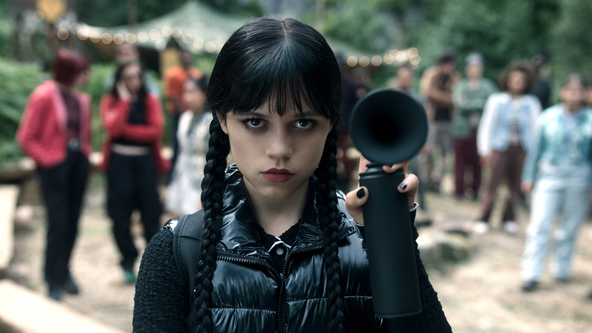 Jenna Ortega as Wednesday Addams holds a black airhorn in 'Wednesday' Season 2. 