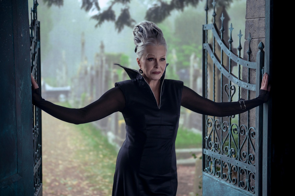 Joanna Lumley as Grandmama stands in an iron gateway in Season 2 of ‘Wednesday’