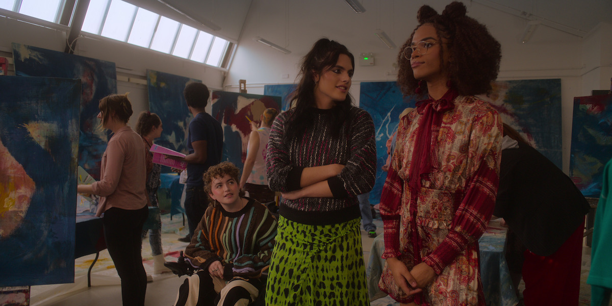 Ash Self as Felix, Bel Priestley as Naomi, and Yasmin Finney as Elle gather in an art classroom in Season 2 of ‘Heartstopper.’ 