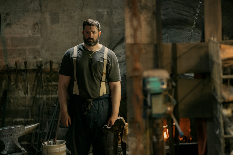 Ger Kelly as Teddy stands in a workshop in 'Bodkin'