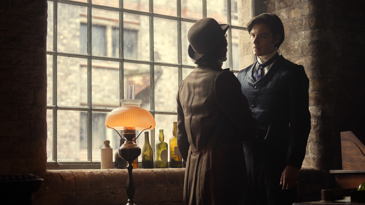 Jack Gleeson as Byron Hedges talks to Louis Partridge as Edward Guinness in ‘House of Guinness’ Season 1.