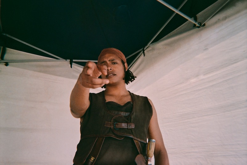 Jacob Romero as Usopp points at the camera in Season 1 of 'One Piece.'