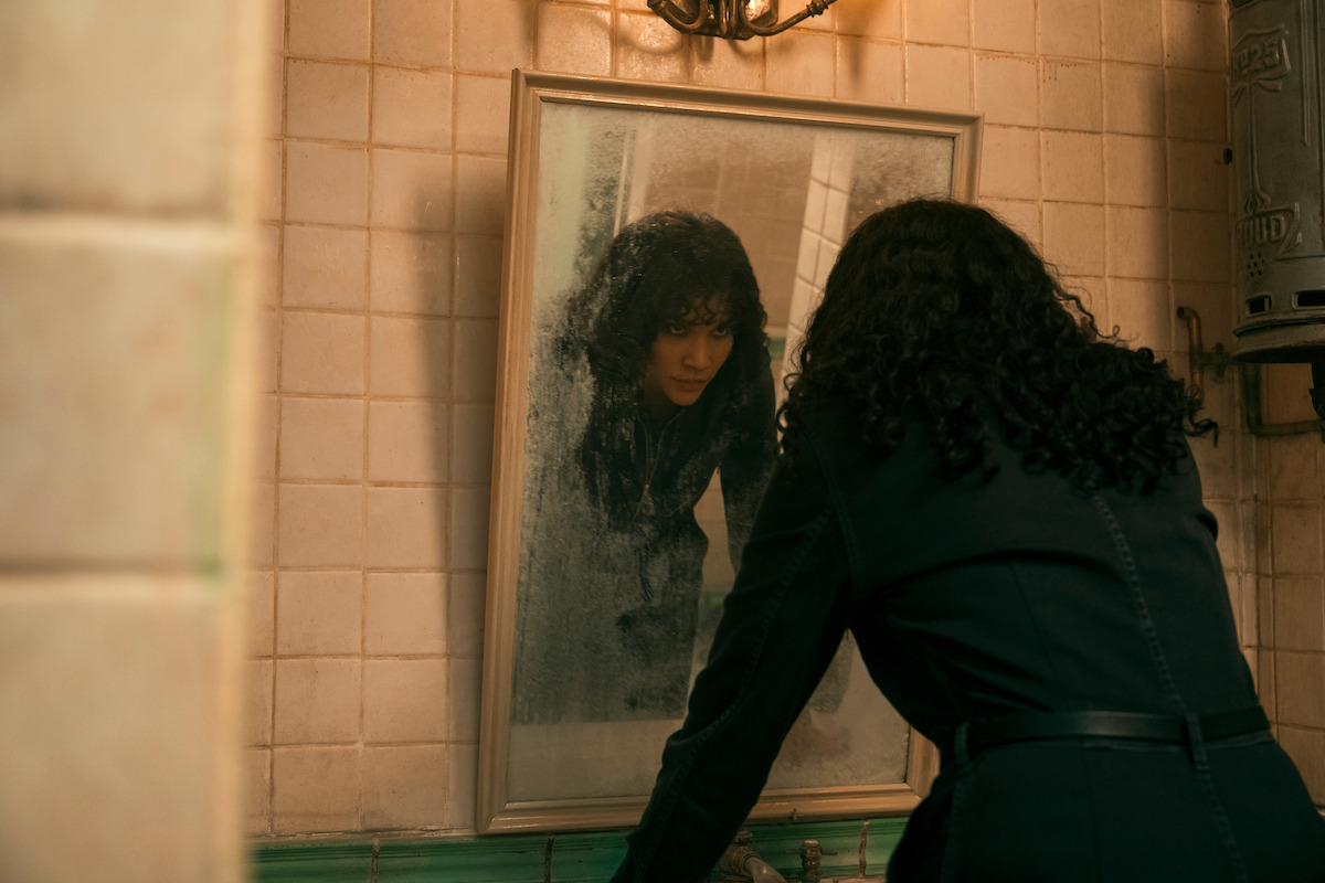 Photo of character looking in mirror