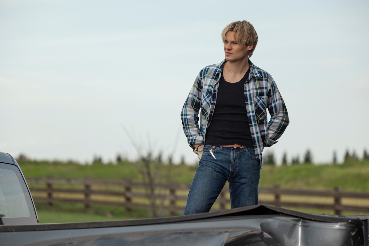 Noah LaLonde as Cole standing in a rural environment in ‘My Life with the Walter Boys’ Season 2.