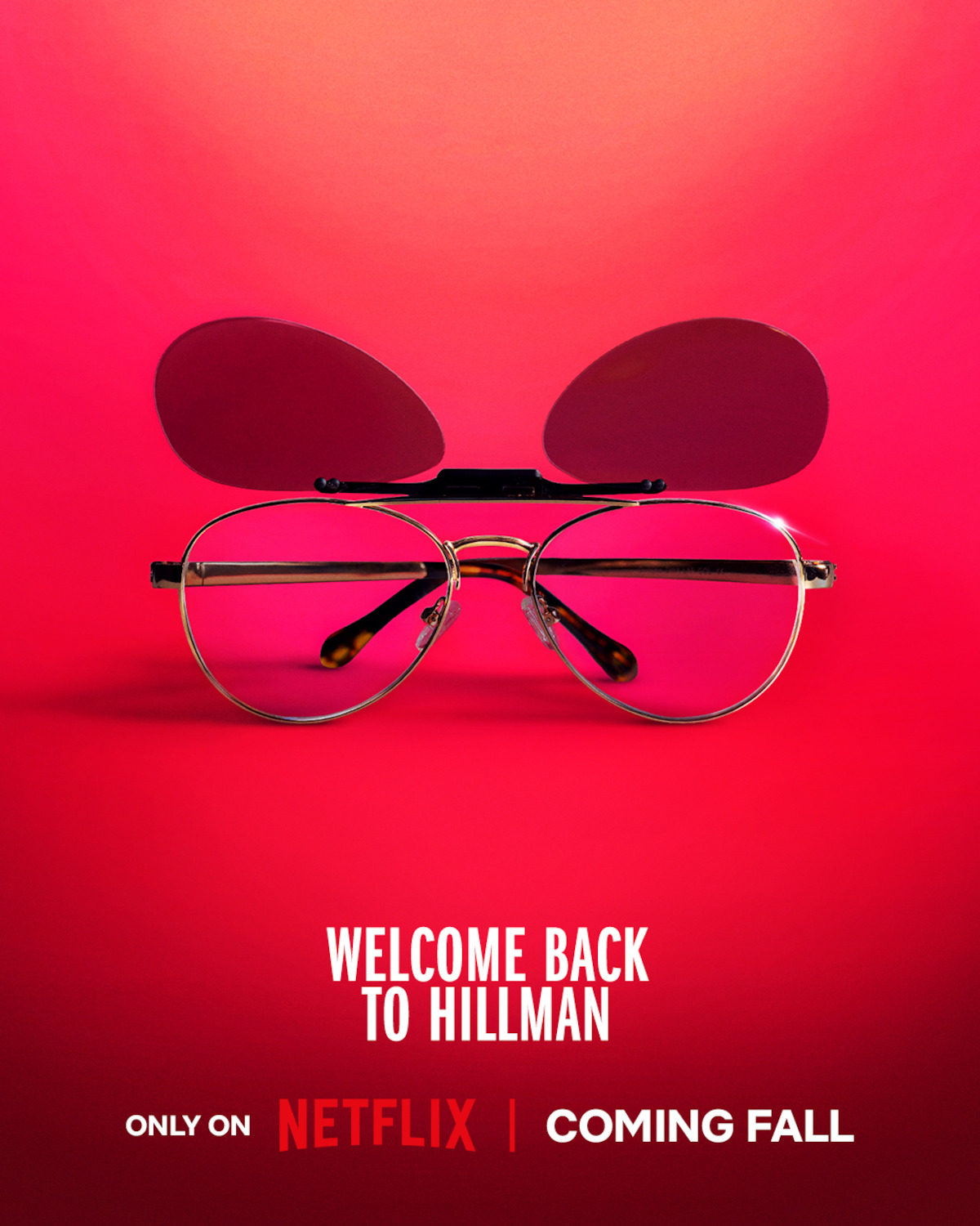 Clip-on sunglasses over eyeglasses on a vibrant pink and red background, with the sunglass lenses flipped up showing both tinted and clear lenses, in a minimal studio setting.