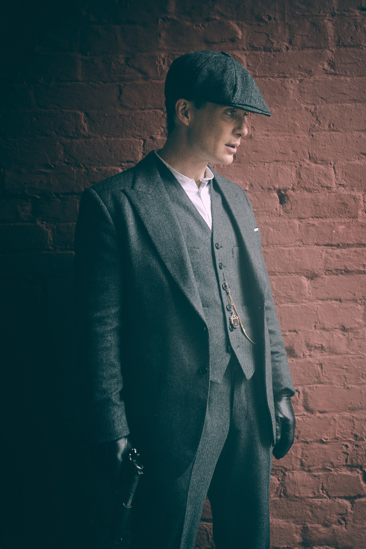 Tommy Shelby in profile wearing his cap in 'Peaky Blinders'
