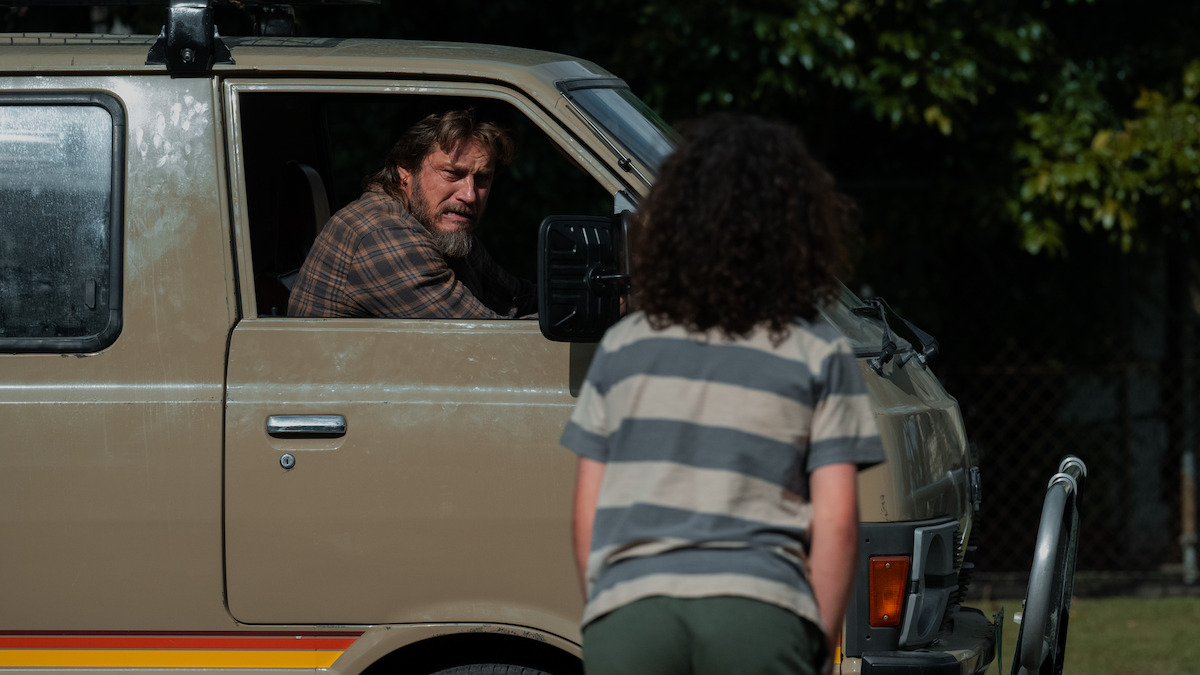 Travis Fimmel as Lyle Orlik and Felix Cameron as young Eli Bell in ‘Boy Swallows Universe’