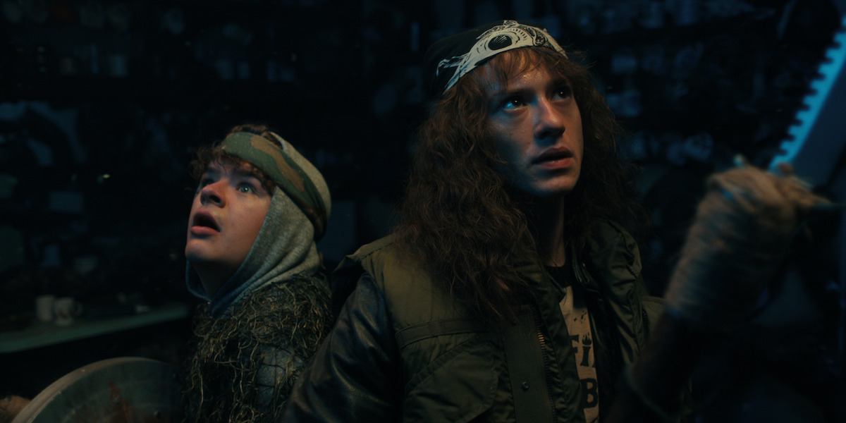 Dungeons & Dragons paladins in mossy armor, Dustin Henderson (Gaten Matarazzo) and Eddie Munson (Joe Quinn)