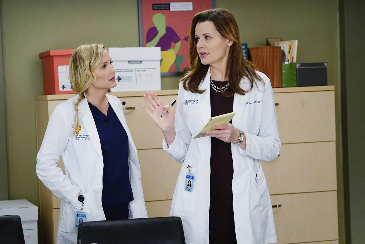 two doctors speak to each other in an office. 