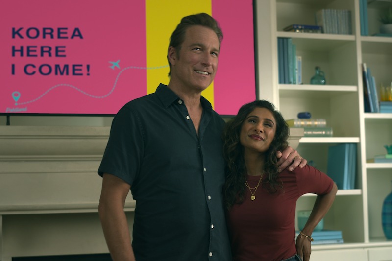 John Corbett as Dan Covey and Sarayu Blue as Trina Rothschild in Season 1 of XO, Kitty. 