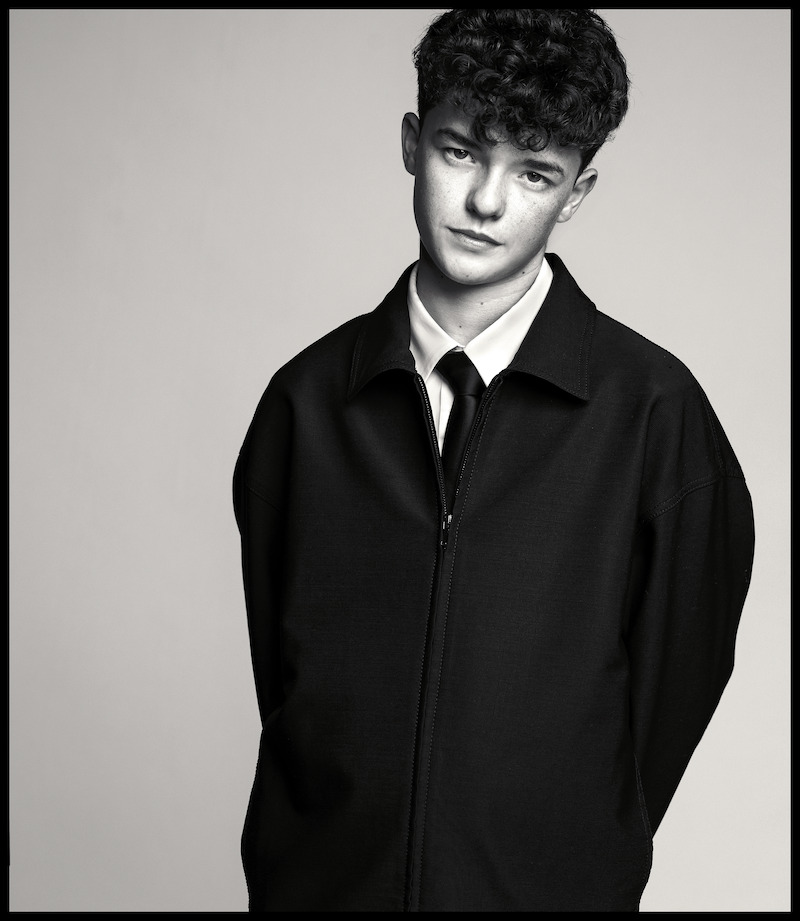 Owen Cooper poses with his hands behind his back.