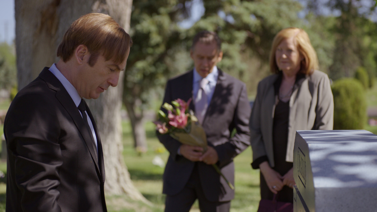 Saul Goodman mourning in a cemetery. 