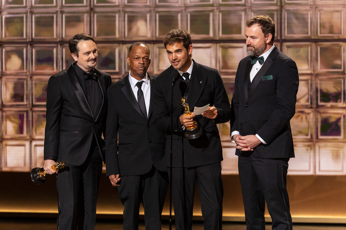 (L-R) David Breschel, Mike Yung, Sam Davis, and Jack Piatt accept the award for Best Live-Action Short for “The Singers” onstage during the 98th Oscars at Dolby Theatre on March 15, 2026 in Hollywood, California.