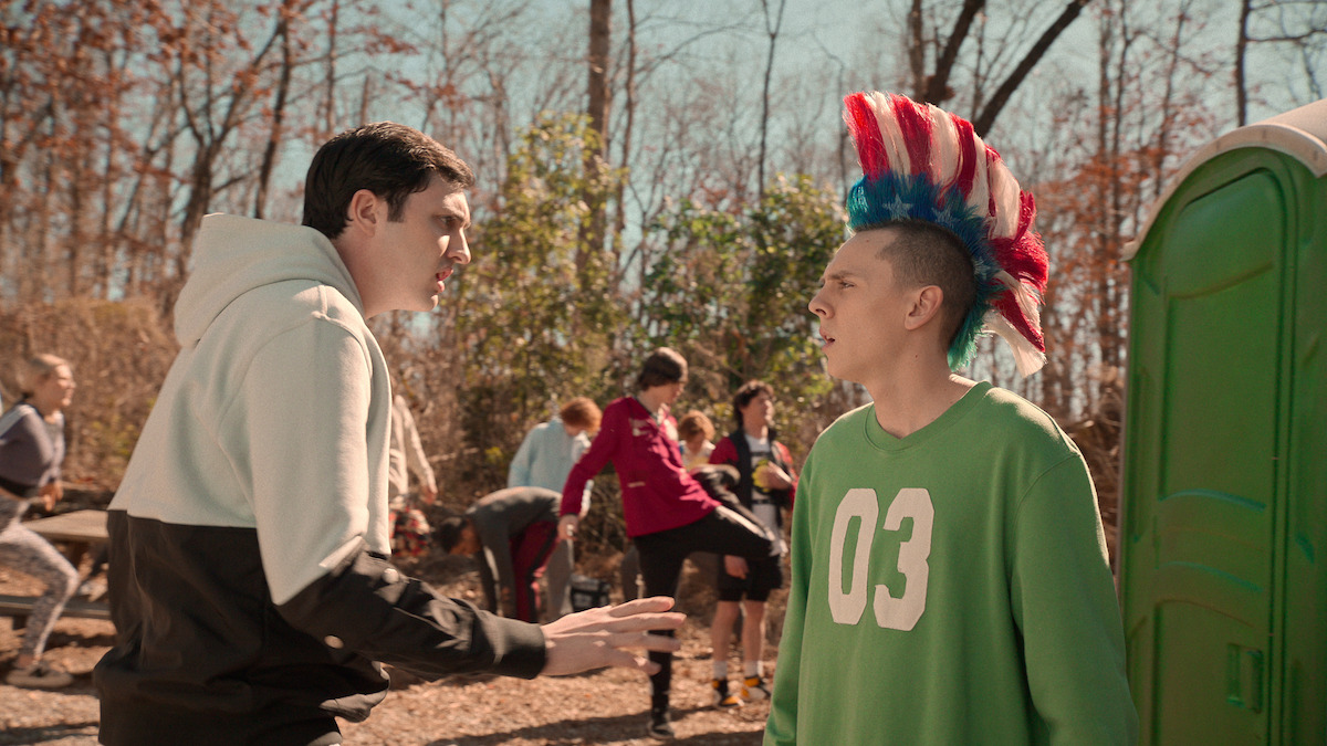 Gianni DeCenzo as Demetri and Jacob Bertrand as Eli 'Hawk' Moskowitz face each other during training in the woods in Season 6 of ‘Cobra Kai’