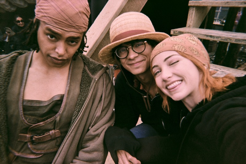 Jacob Gibson as Usopp, Iñaki Godoy as Monkey D. Luffy, and Emily Rudd as Nami smile together for a selfie in Season 1 of 'One Piece.'