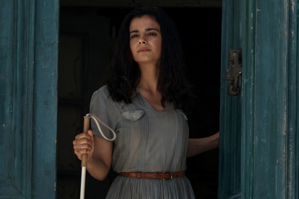 Aria Mia Loberti as Marie-Laure in Episode 1 of All the Light We Cannot See.