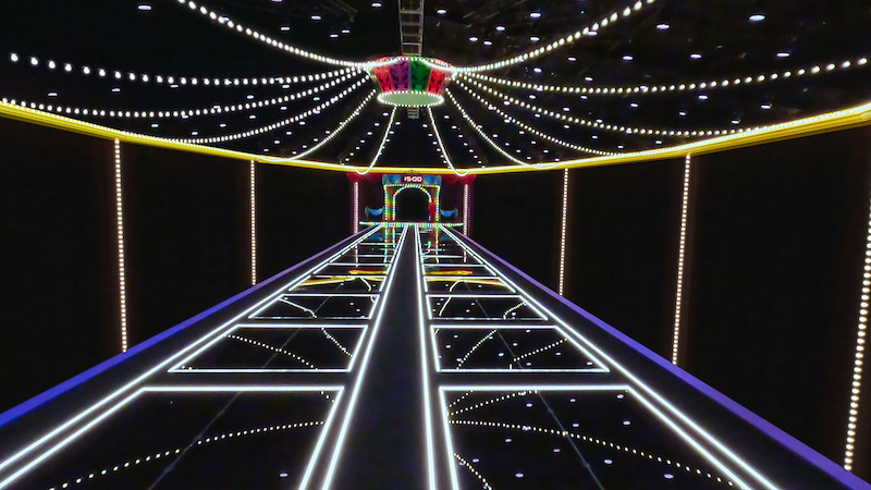 A hallway with illuminated squares. 