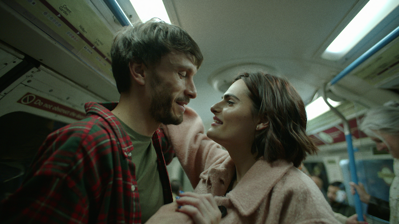 Richard Gadd as Donny Dunn Nava Mau as Teri face each other smiling in 'Baby Reindeer'