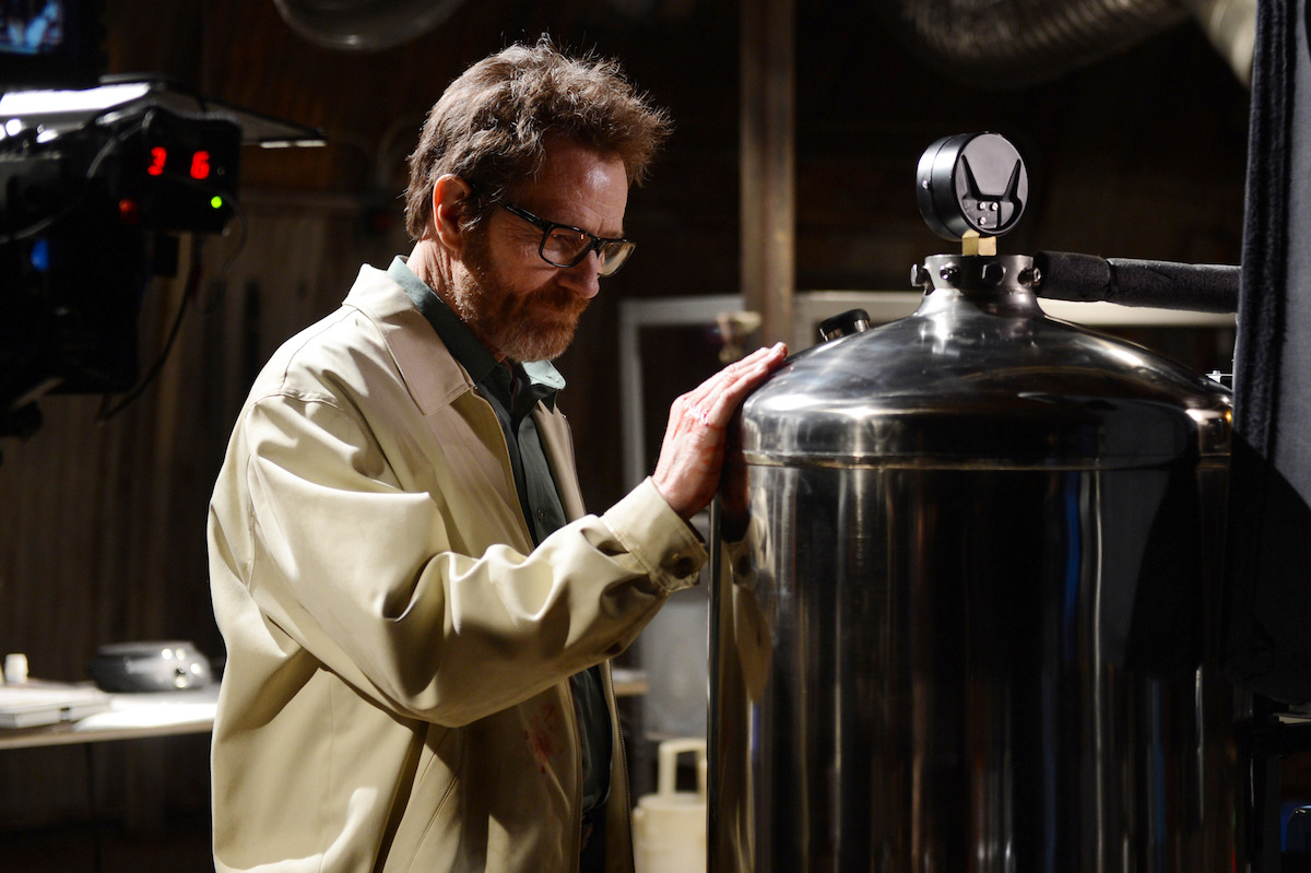 Walter White looks fondly at a meth lab tank of chemicals