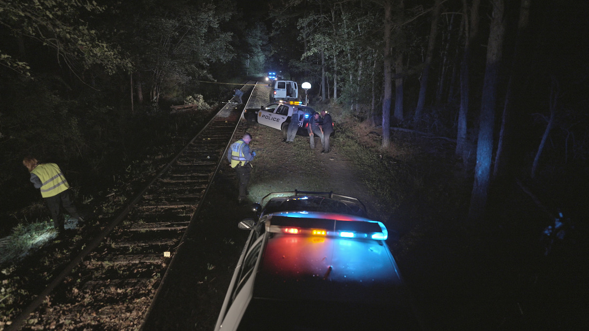 Police cars at a crime scene.