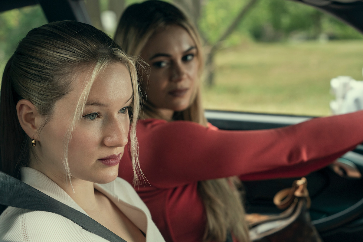West Duchovny as Shannon Shaeffer and Dina Shihabi as Britt Hufford sit in a car together in Season 1 of ‘Painkiller.’