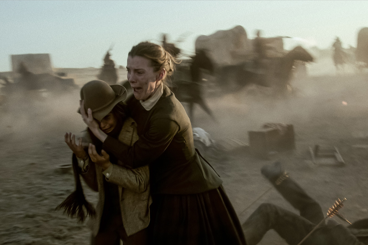 Preston Mota as Devin Rowell and Betty Gilpin as Sara Rowell in ‘American Primeval’