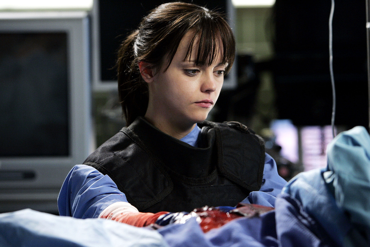 A doctor attends to her patient. 