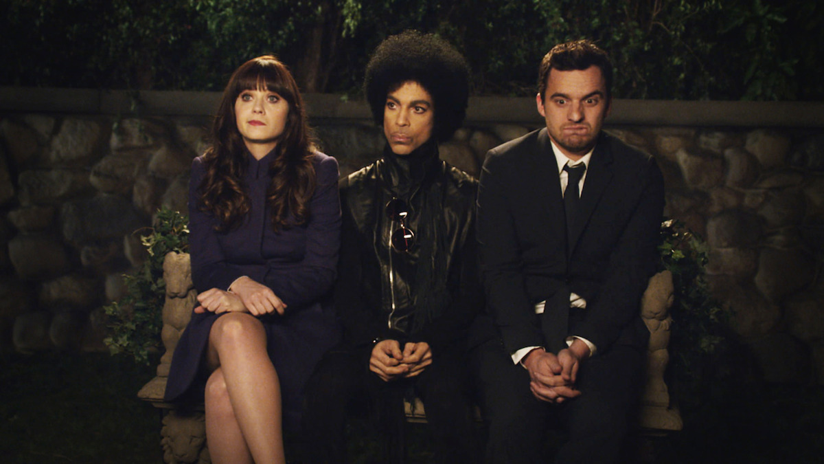 Jess and Nick sit on a bench with Prince