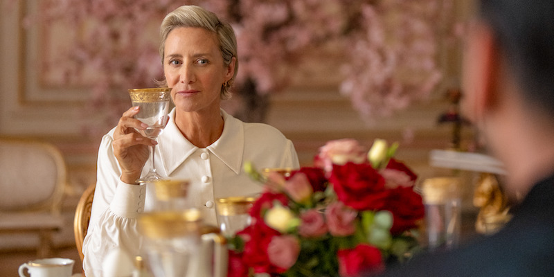 Janet McTeer as Hera sits at a fancy table with flowers in 'KAOS'