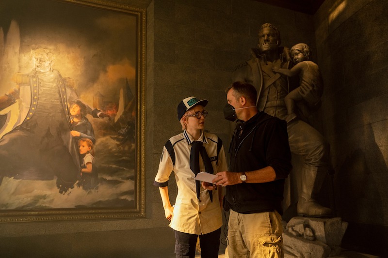 Morgan Davies as Koby and director Marc Jobst talking on the set of Season 1 of 'One Piece.'