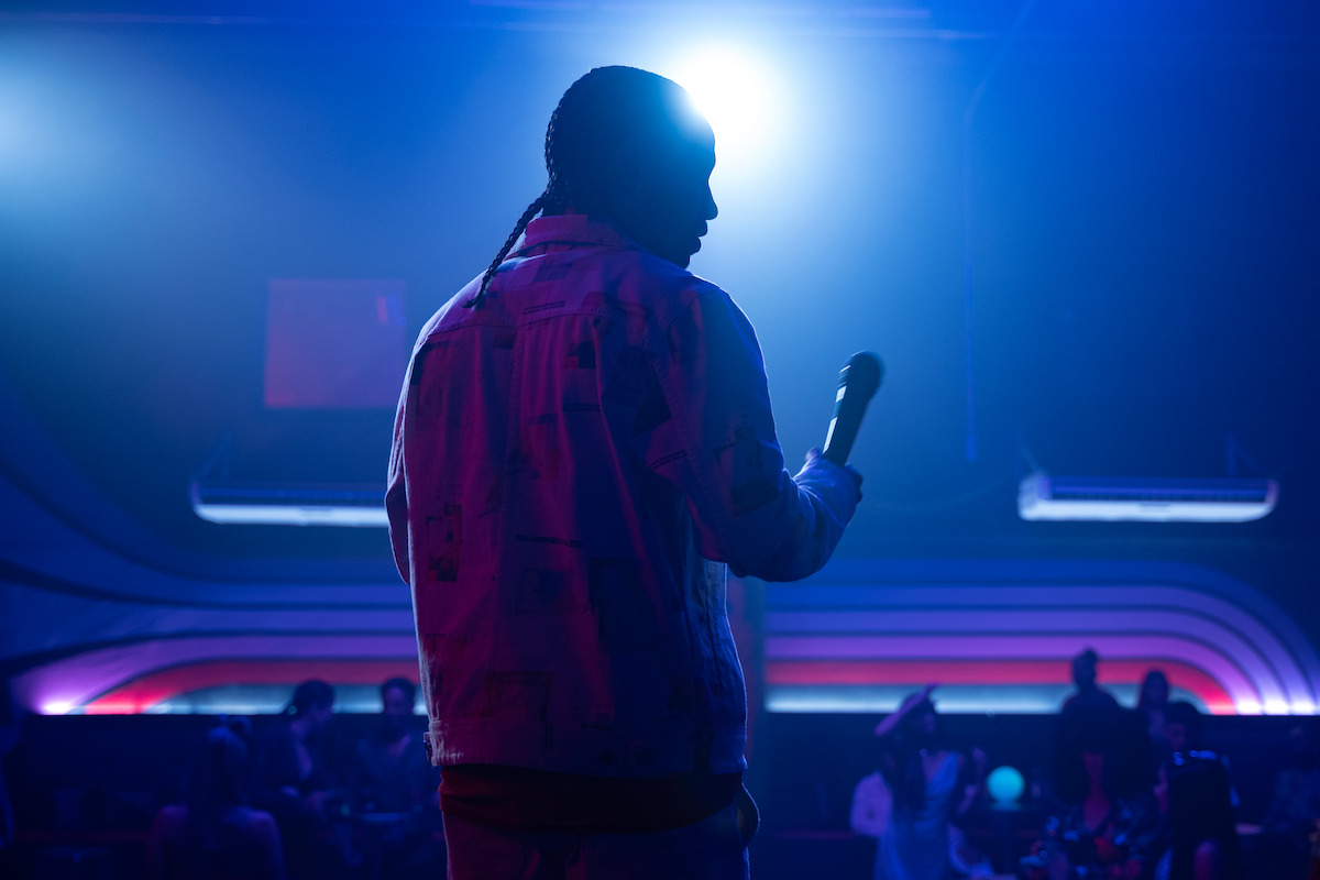 Tyler Dean Flores as Santi performs on stage in Season 1 of ‘Neon.’