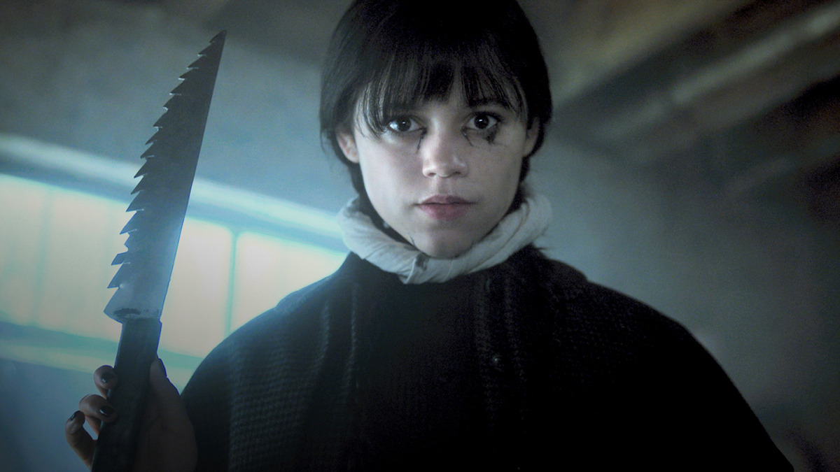 Jenna Ortega as Wednesday Addams holds a large knife in 'Wednesday' Season 2