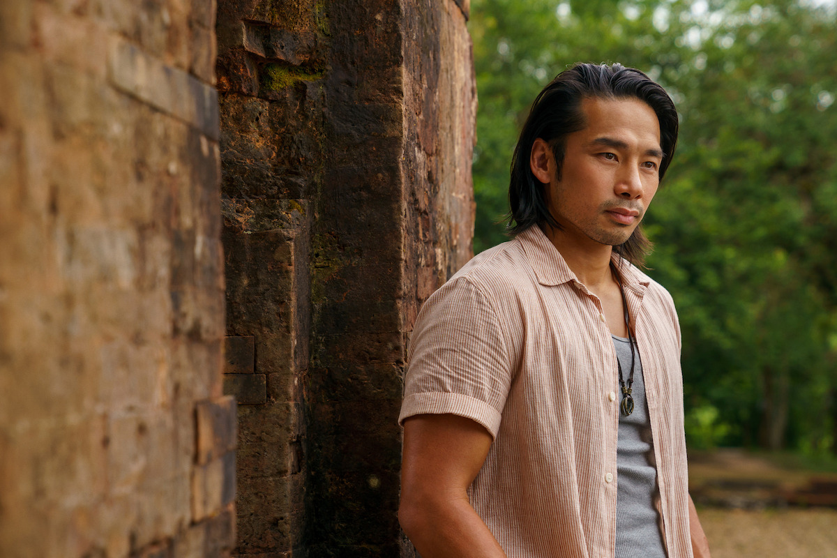 A man leans against a wall in a still from ‘A Tourist’s Guide to Love.'