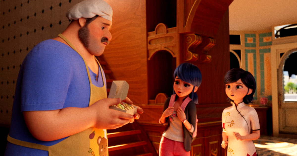 Marinette talks with a friend in the school hallway