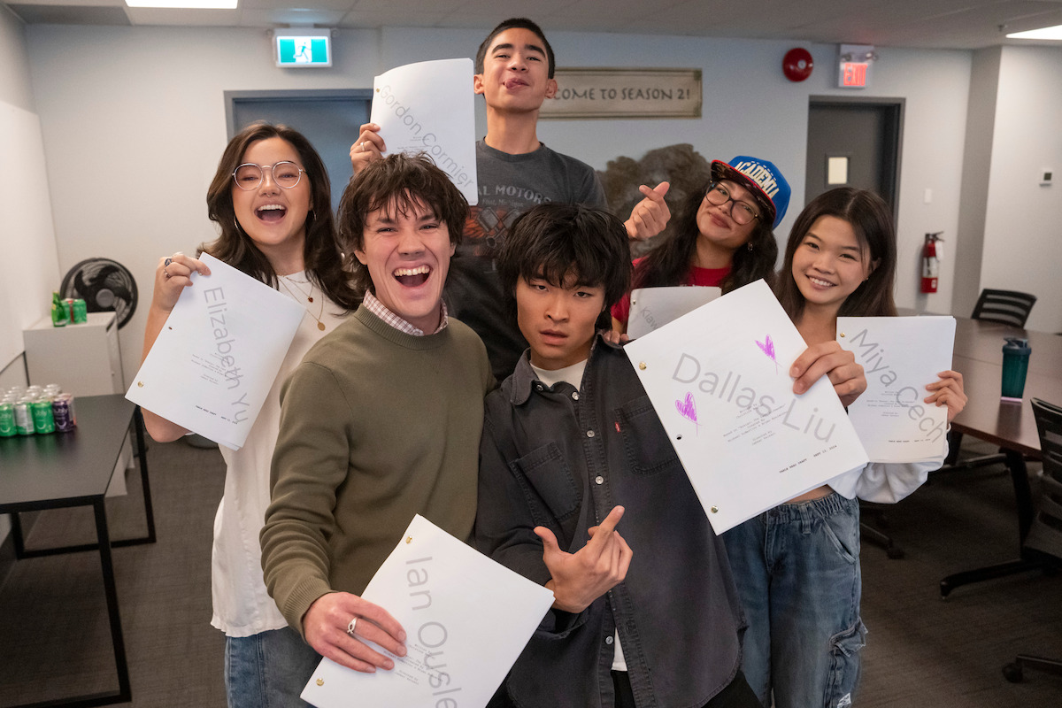 Elizabeth Yu, Ian Ousley, Gordon Cormier, Dallas Liu, Kiawentiio, and Miyako pose together holding scripts for Season 2 of ‘Avatar: The Last Airbender’
