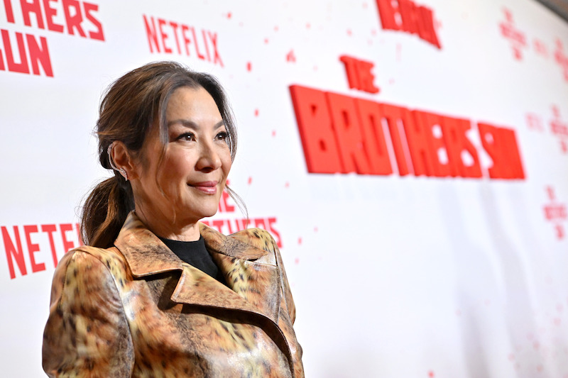 Michelle Yeoh attends Netflix's 'The Brothers Sun' Los Angeles Premiere at Netflix Tudum Theater wearing a gold dress