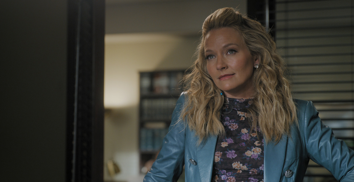 Becki Newton as Lorna Crane in ‘The Lincoln Lawyer’ Season 2, wearing a blue leather blazer.