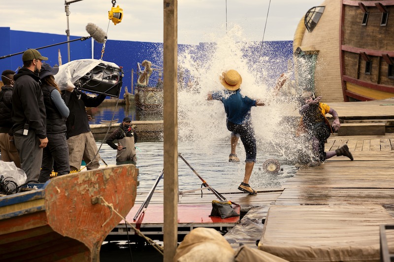 Water splashing at Iñaki Godoy as Monkey D. Luffy on the set of season 1 of 'One Piece'.
