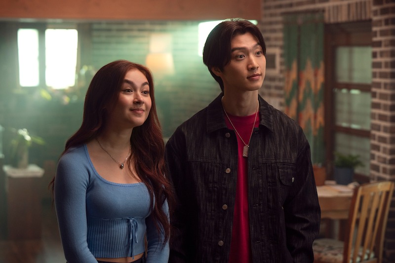 Anna Cathcart as Kitty Song Covey and Sang Heon Lee as Min Ho Moon stand together in Season 2 of 'XO, Kitty'