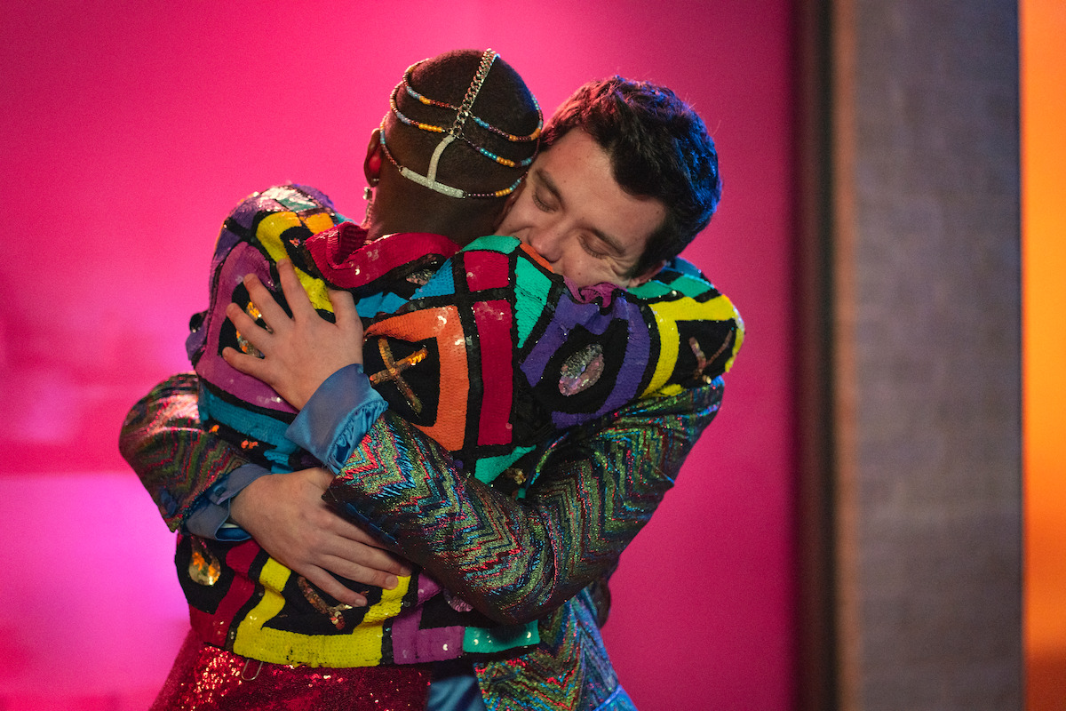 Ncuti Gatwa as Eric and Asa Butterfield as Otis hug in Season 4 of ‘Sex Education.’