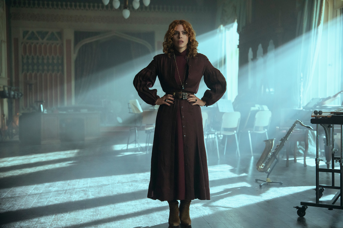 Billie Piper as Isadora Capri stands with her hands on her hips in ‘Wednesday’ Season 2.