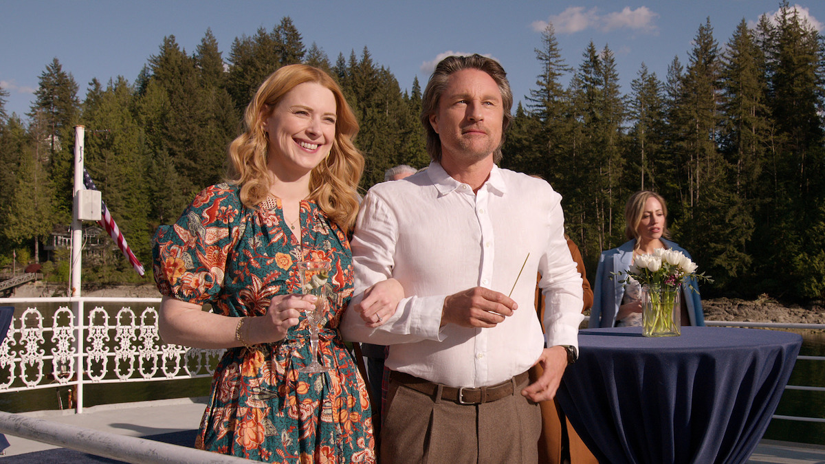 Martin Henderson as Jack Sheridan and Alexandra Breckenridge as Mel link arms and smile together in Season 6 of 'Virgin River.' 